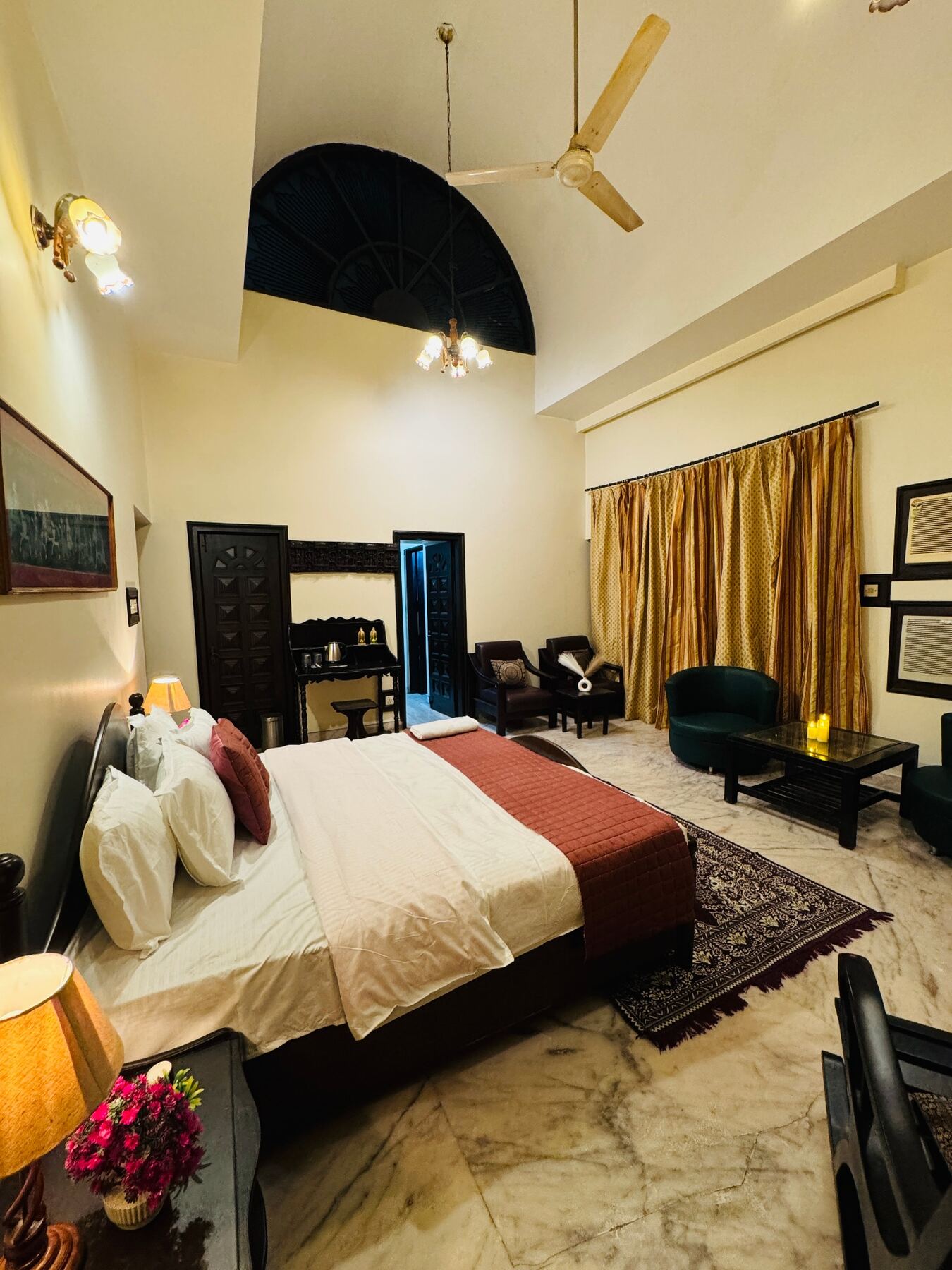 A villa suite interior with cream linens